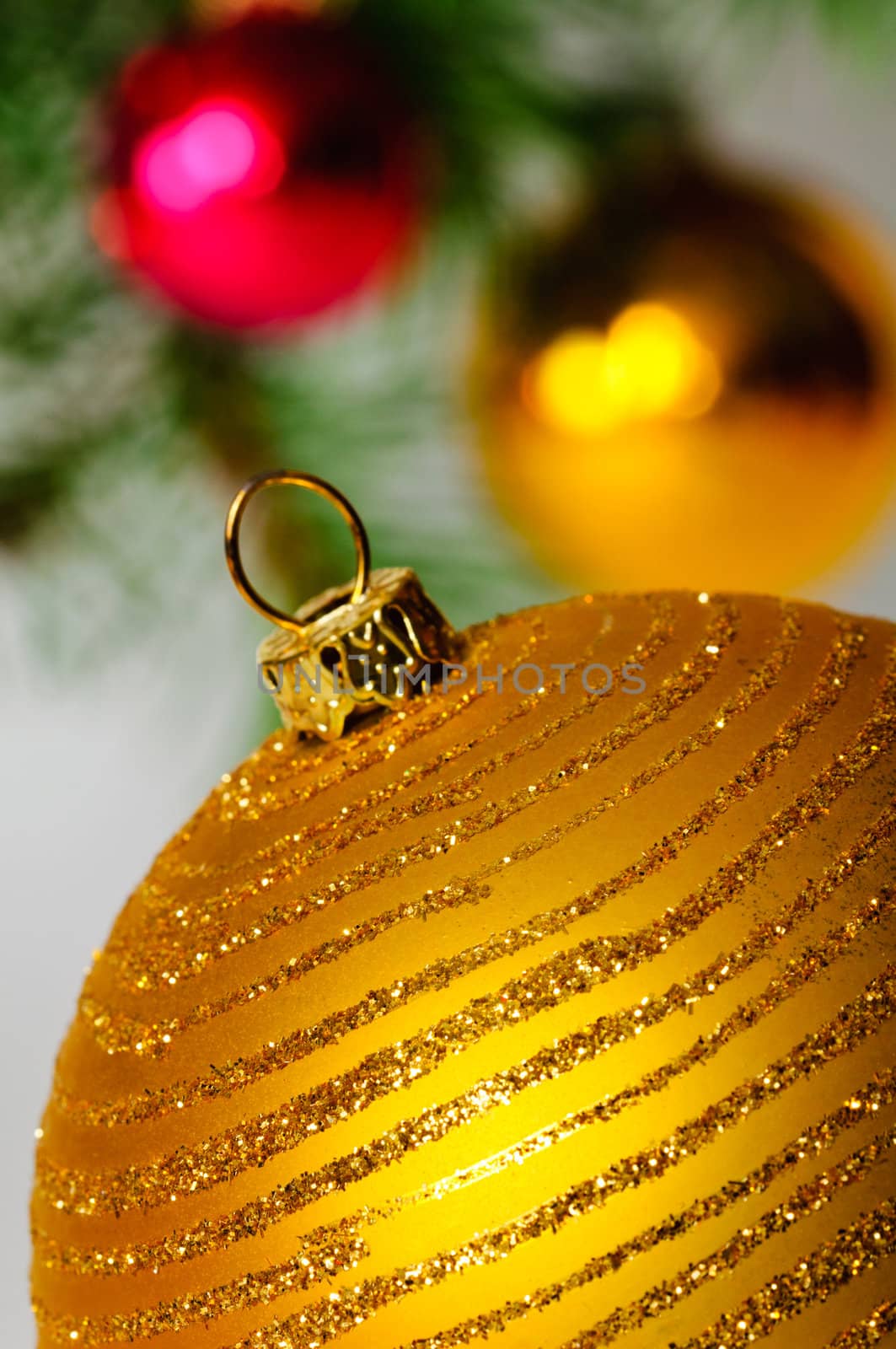 Close up decorative ball on the background of Christmas tree.