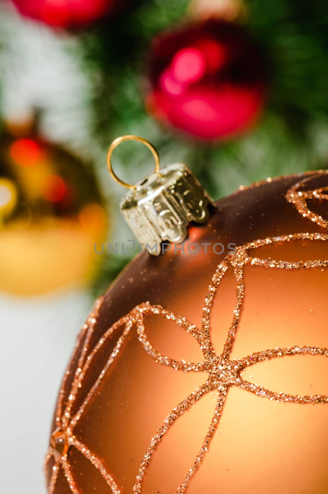 Close up decorative ball on the background of Christmas tree.