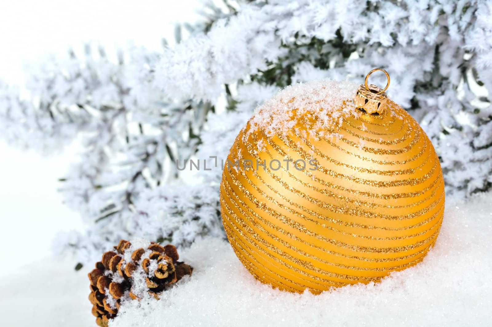 Close up of decorative Christmas ball on the snow and Christmas  by lobzik