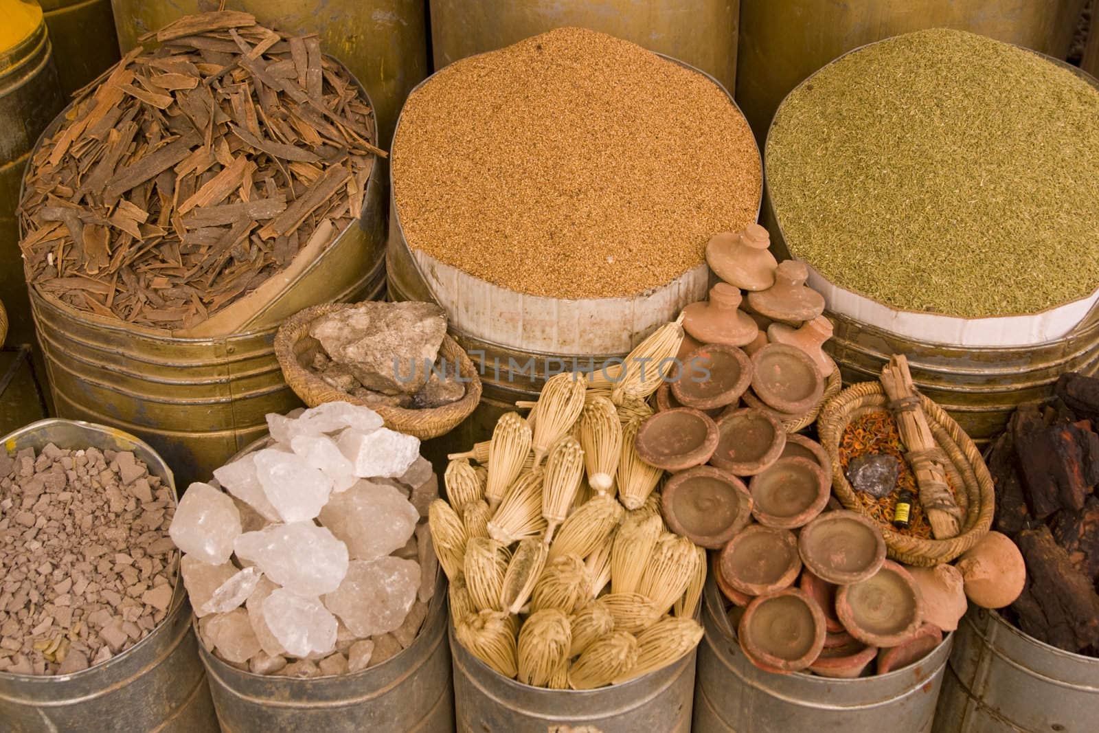 Containers of herbs and spices for sale in a shop in the historic heart of Marrakesh, Morocco