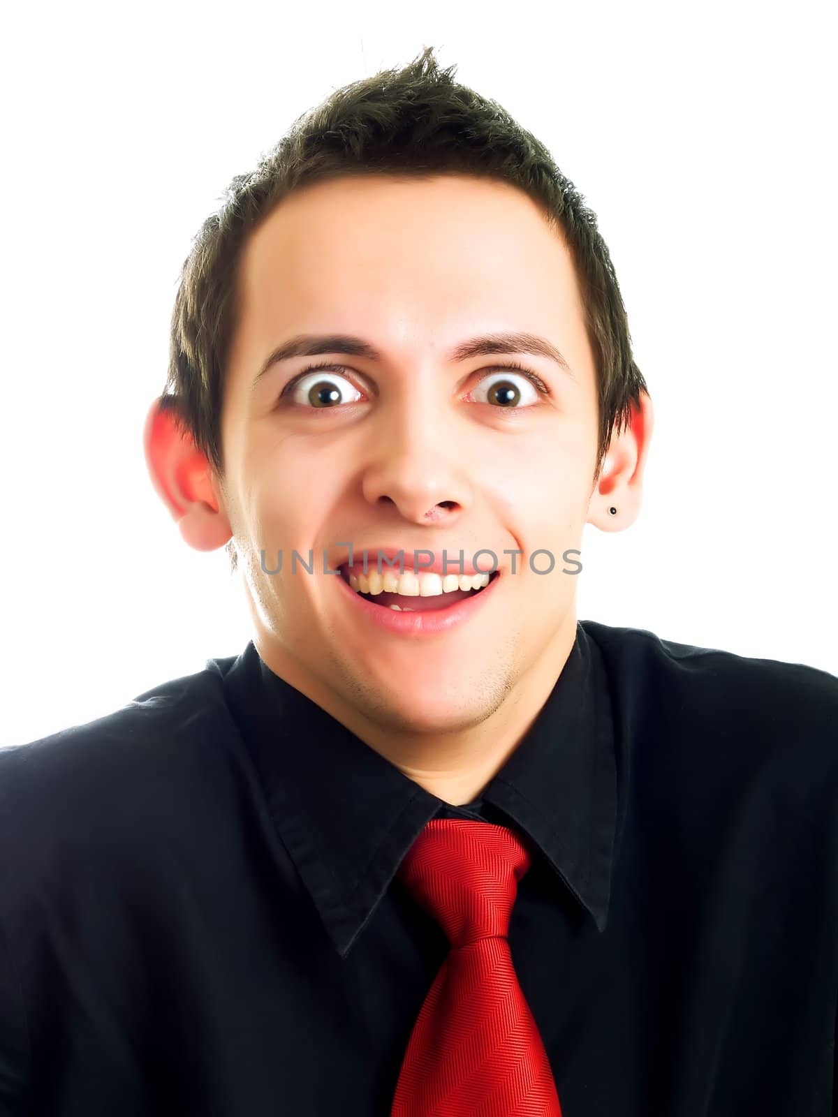 Happy young businessman laughing