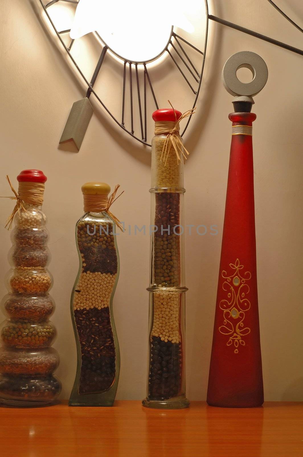 A row of decorative stylish bottles over white wall