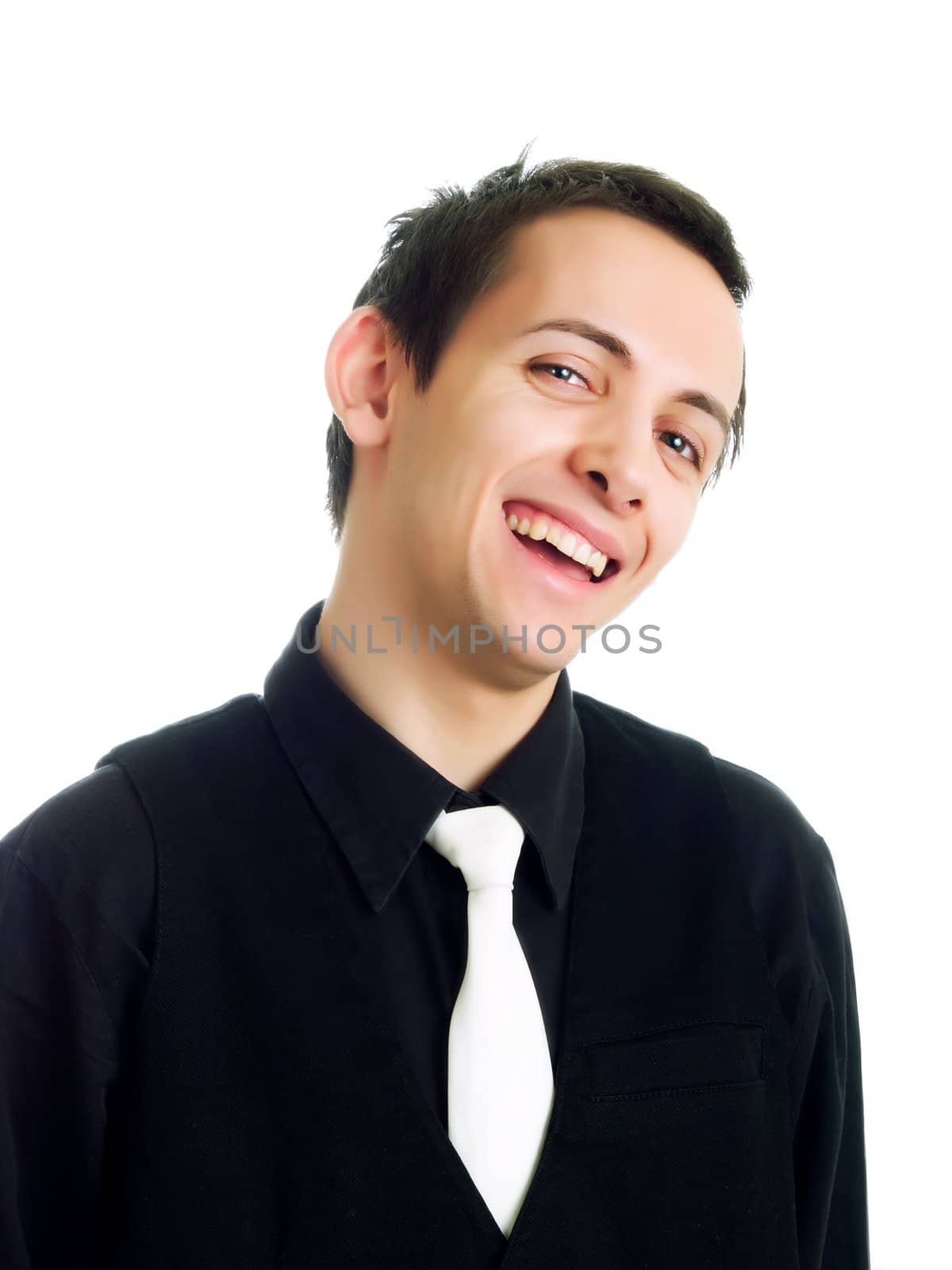 Happy young businessman laughing