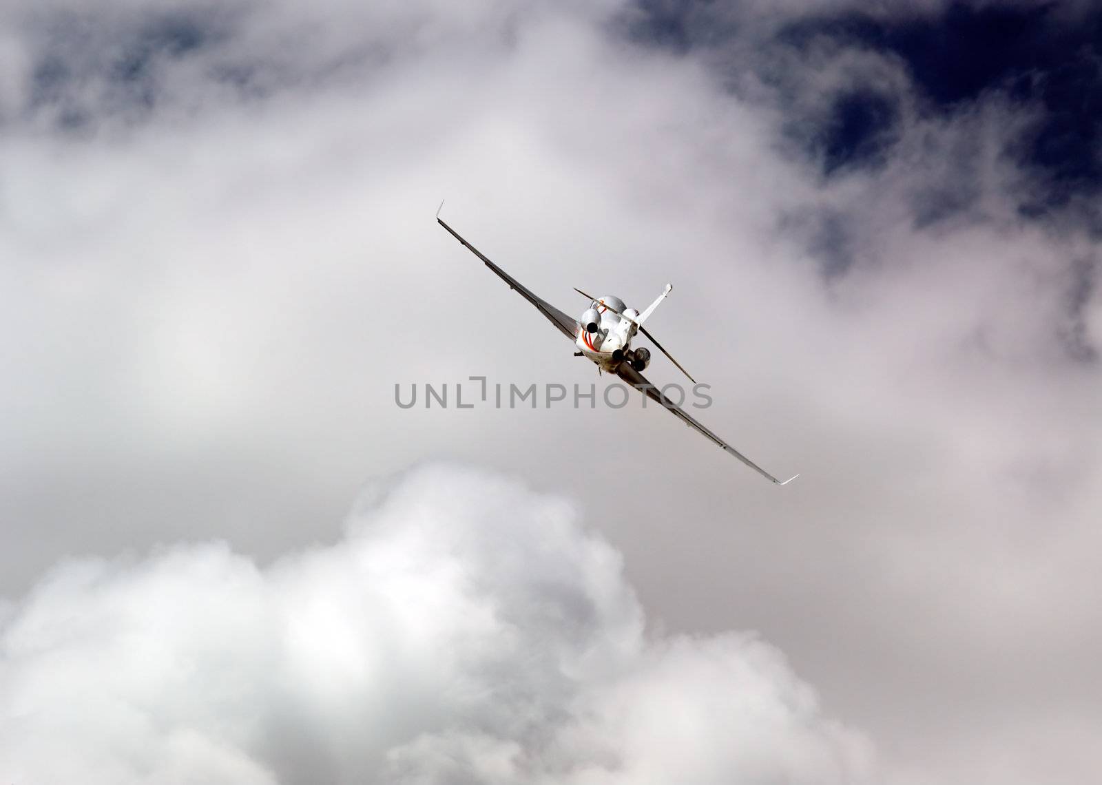 Private airplane flying through the clouds