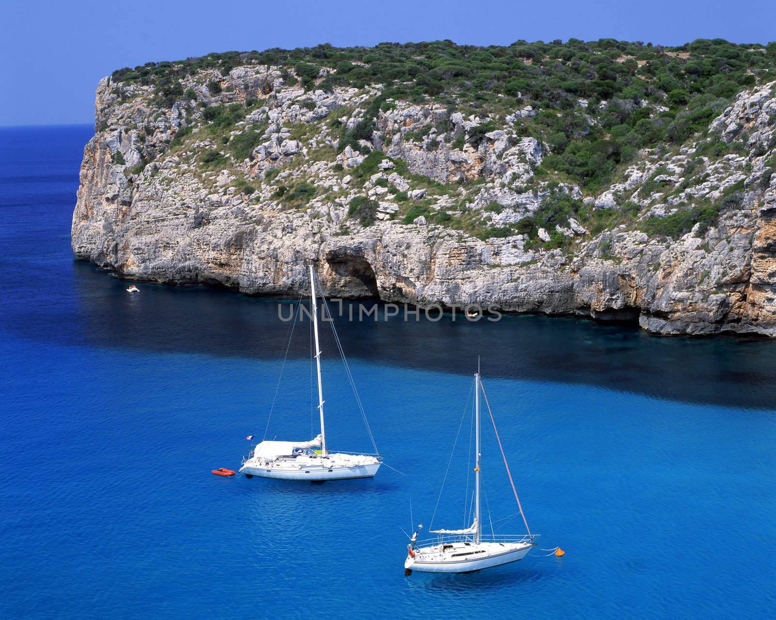 Two sail boats in the bay of Paleokastritsa on the greek island of Corfu