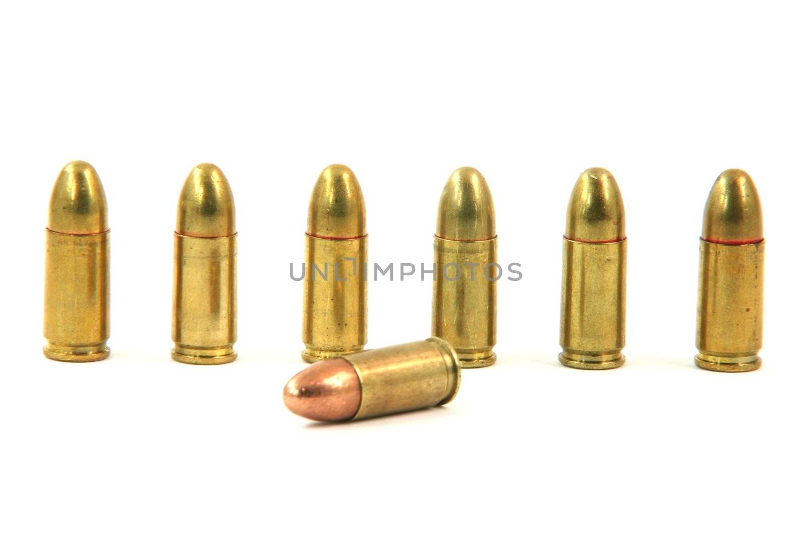 seven bullets isolated on white background weapons ammo