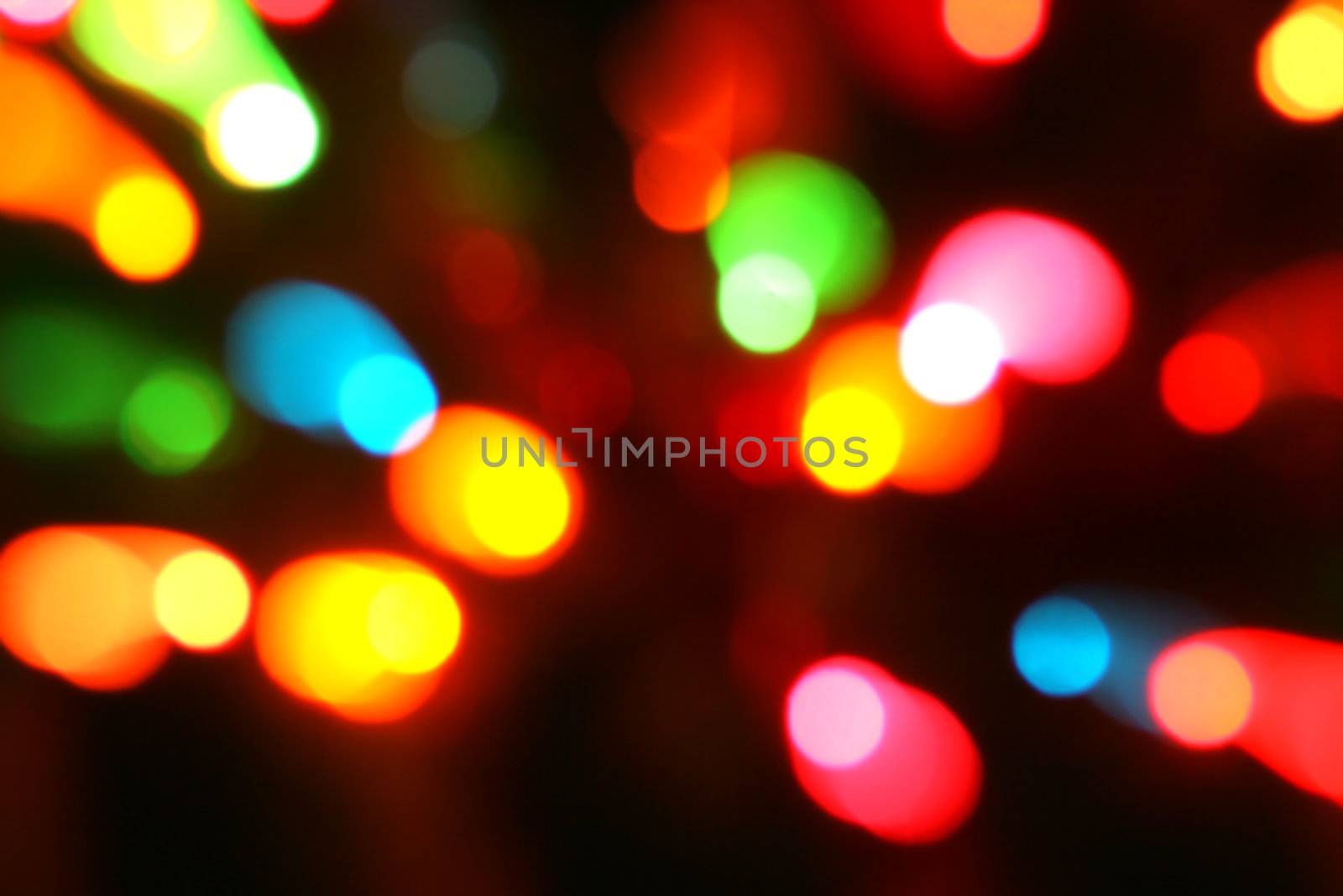 Abstract of holiday lights with an in camera zoom effect.
