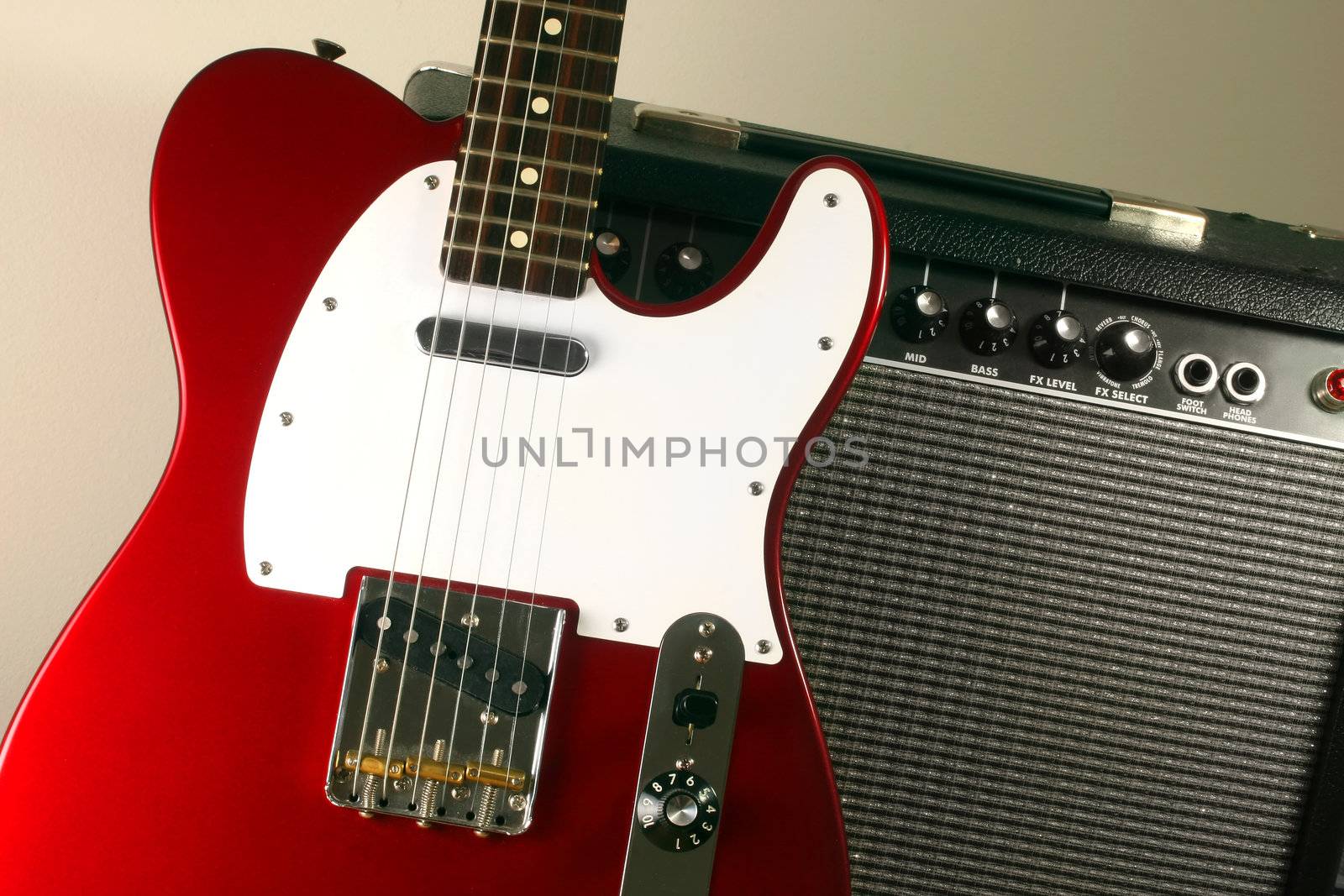 Red electric guitar and amp.