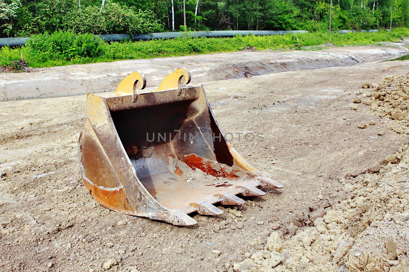 bucket form an excavator on the ground outdoor