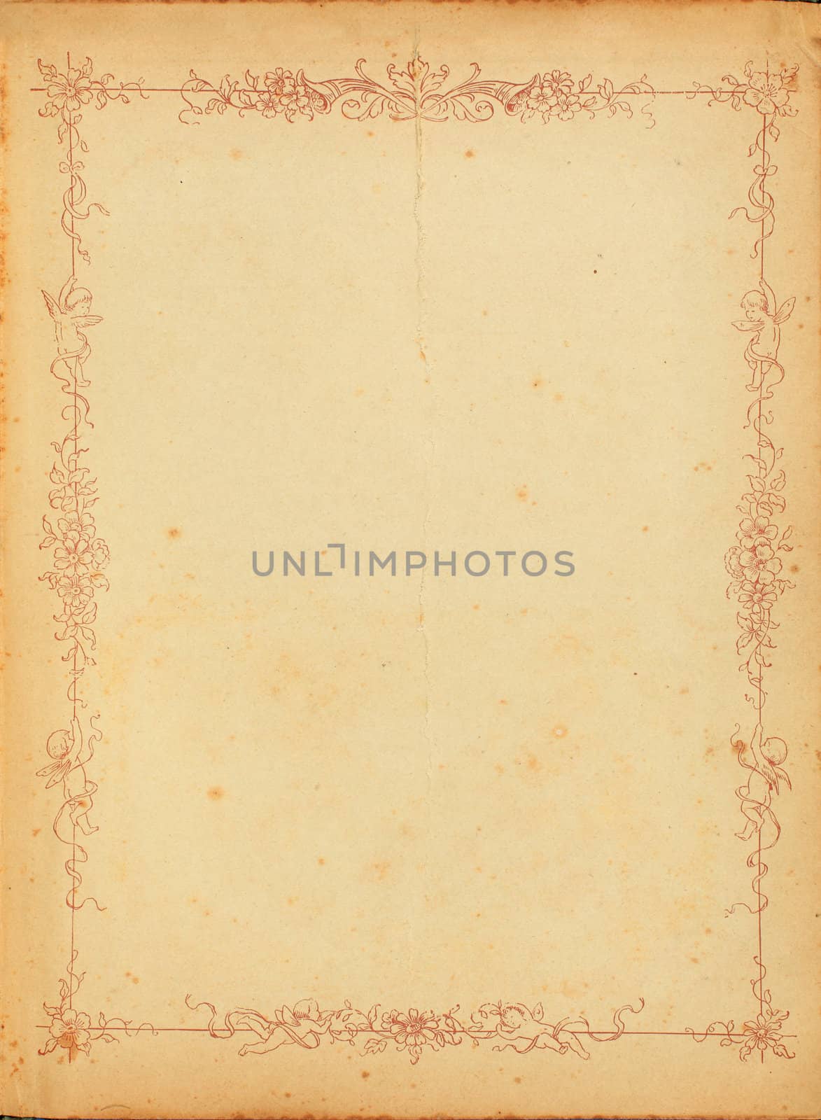 Photo of old stained yellowed paper from the 1920s with a floral border design.
