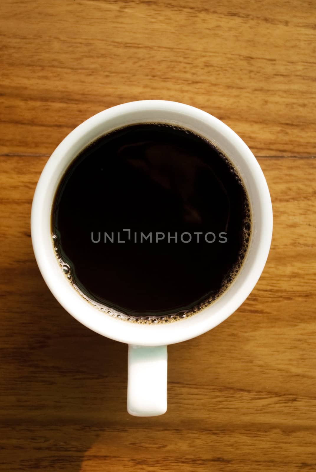 Hot coffee cup on wooden table by pixbox77