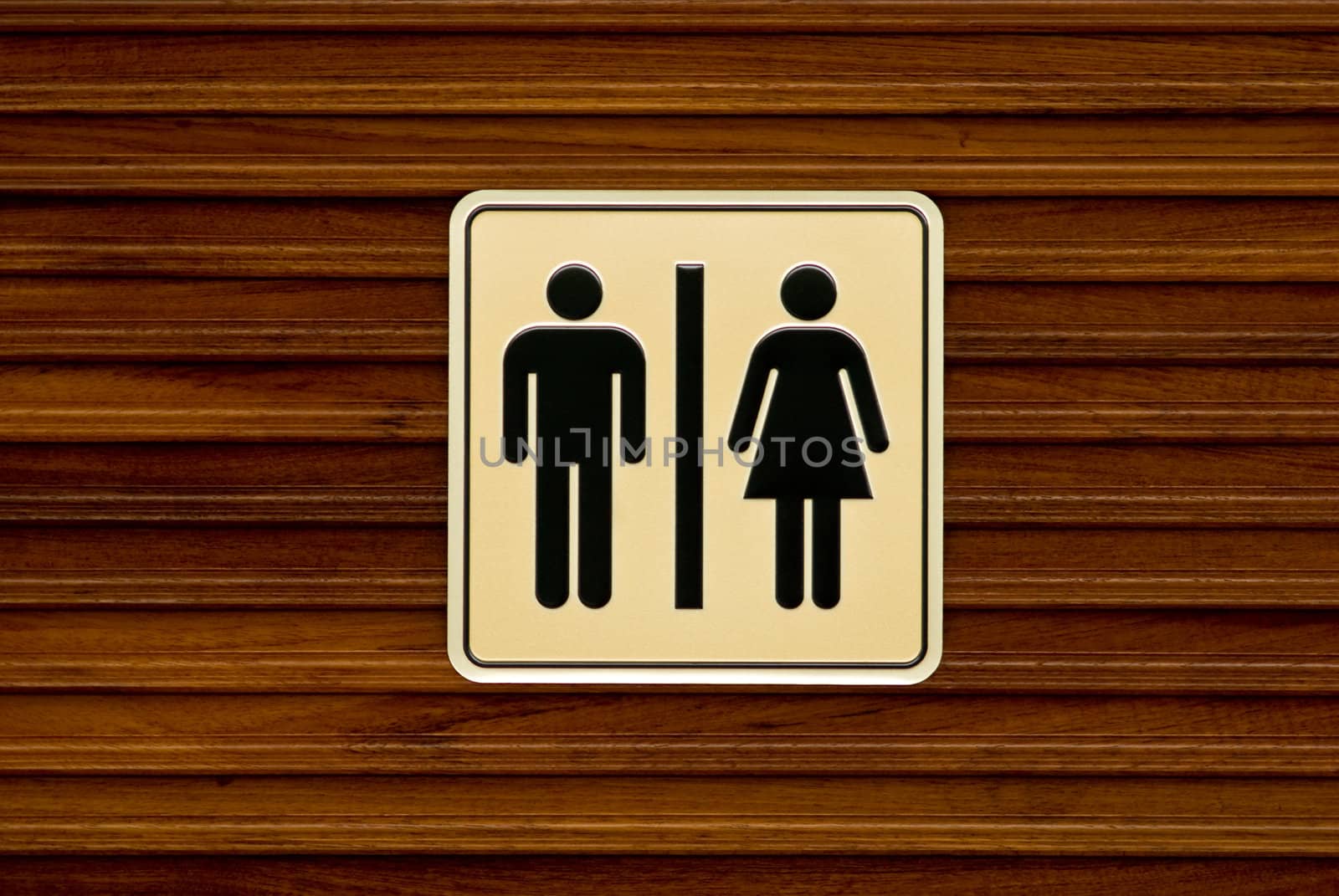 Toilet sign on wooden wall by pixbox77