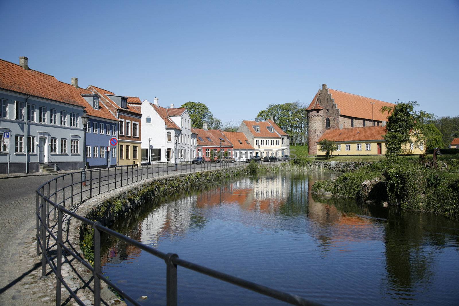 Beautiful old houses along the moat. The more than 800 years old Nyborg Castle in the background