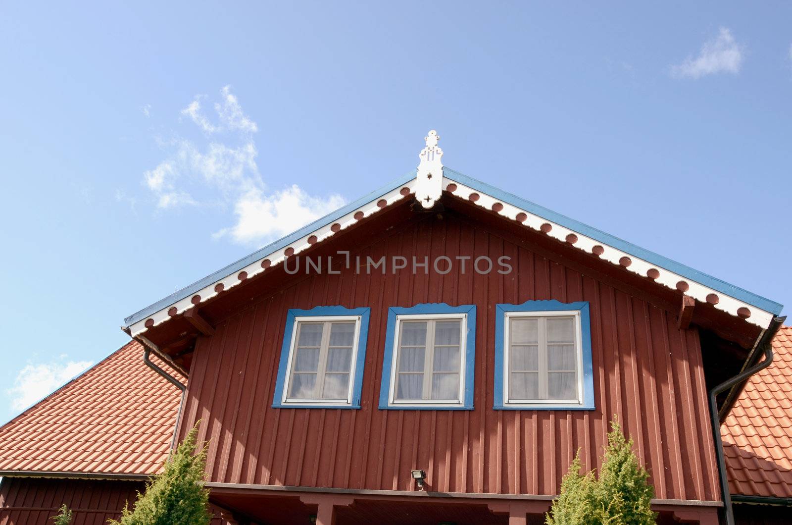 Gorgeous apartment house. Red, blue and white painted walls. Beautiful architectural solution.