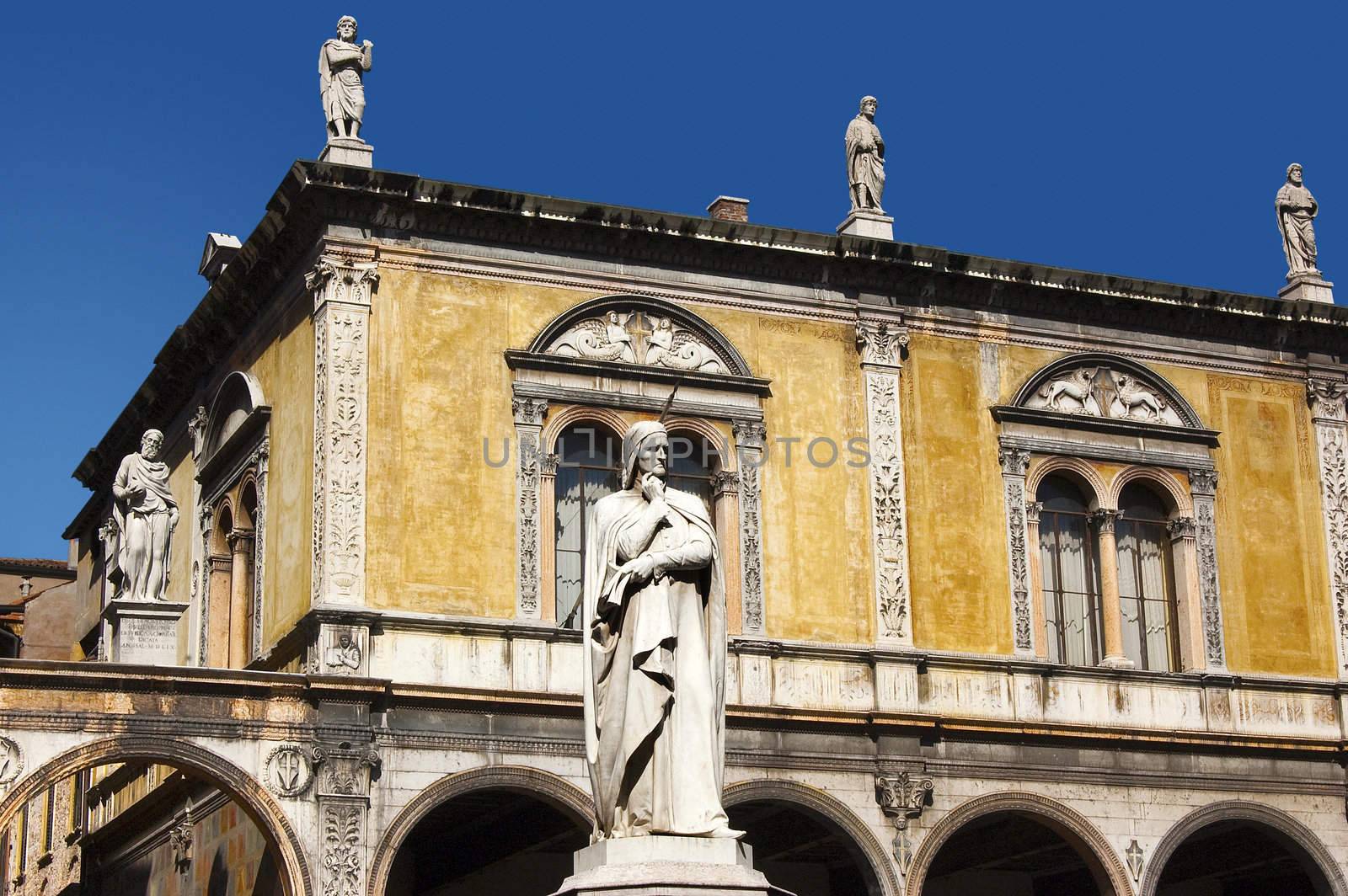Photo of Dante square in Verone, in the foreground with the white statue of Dante Alighieri