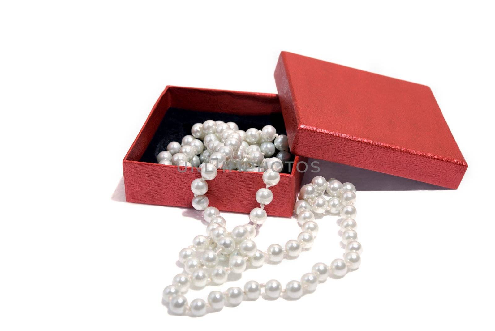 Necklace pearls in a gift box isolated on white background.