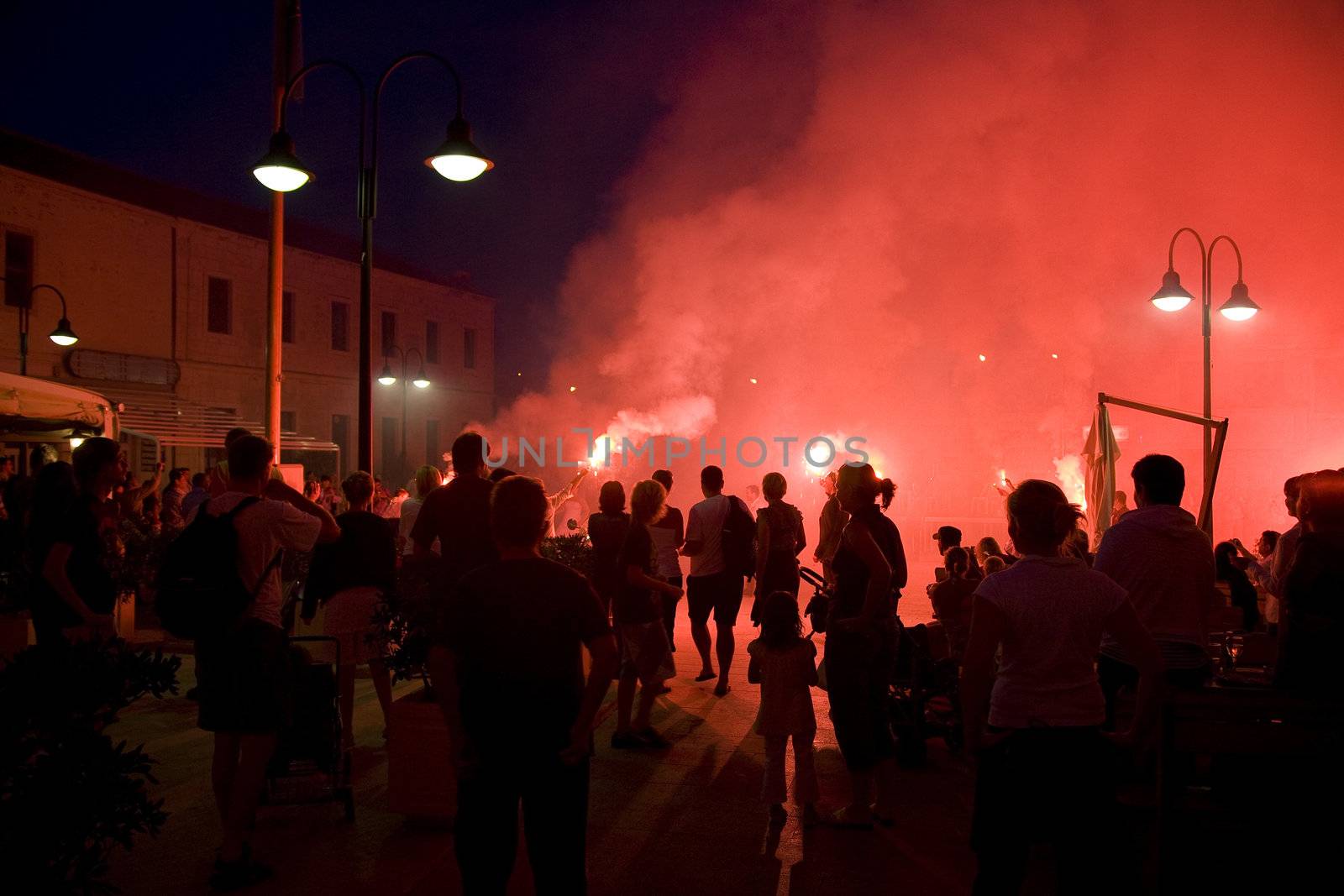 Red firework celebration after a Croatian wedding.