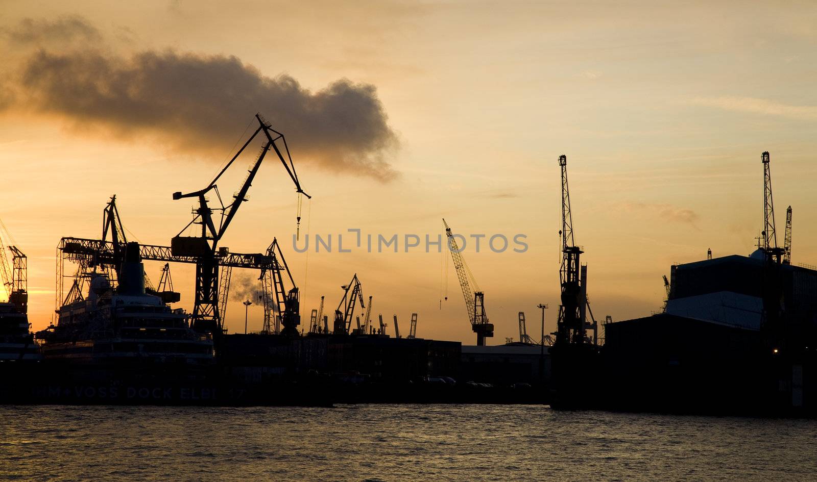 Sunset in the harbor of Hamburg - Germany.