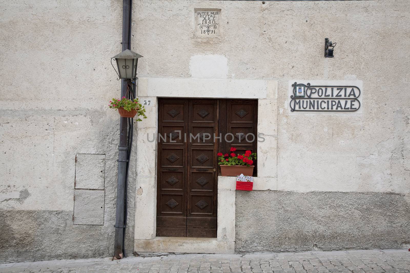 Closed police station at siesta time - take a folder. -  Pescocostanzo, region of Abruzzo, Italy.