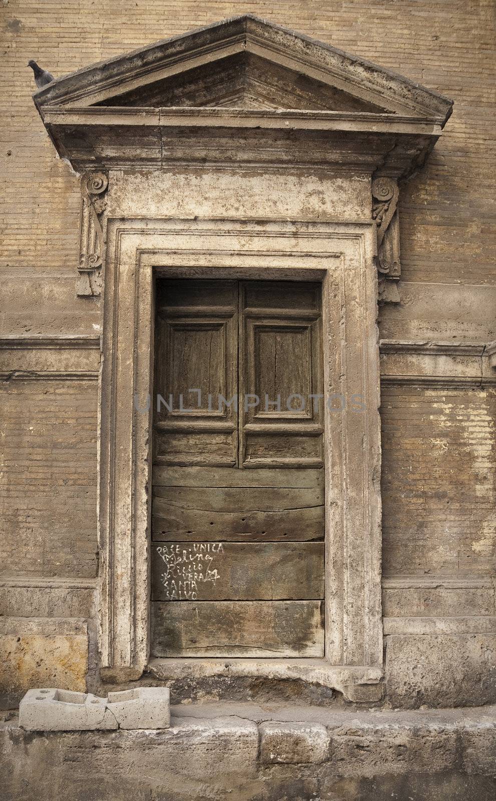 Beautiful old urban weathered Roman entrance. 