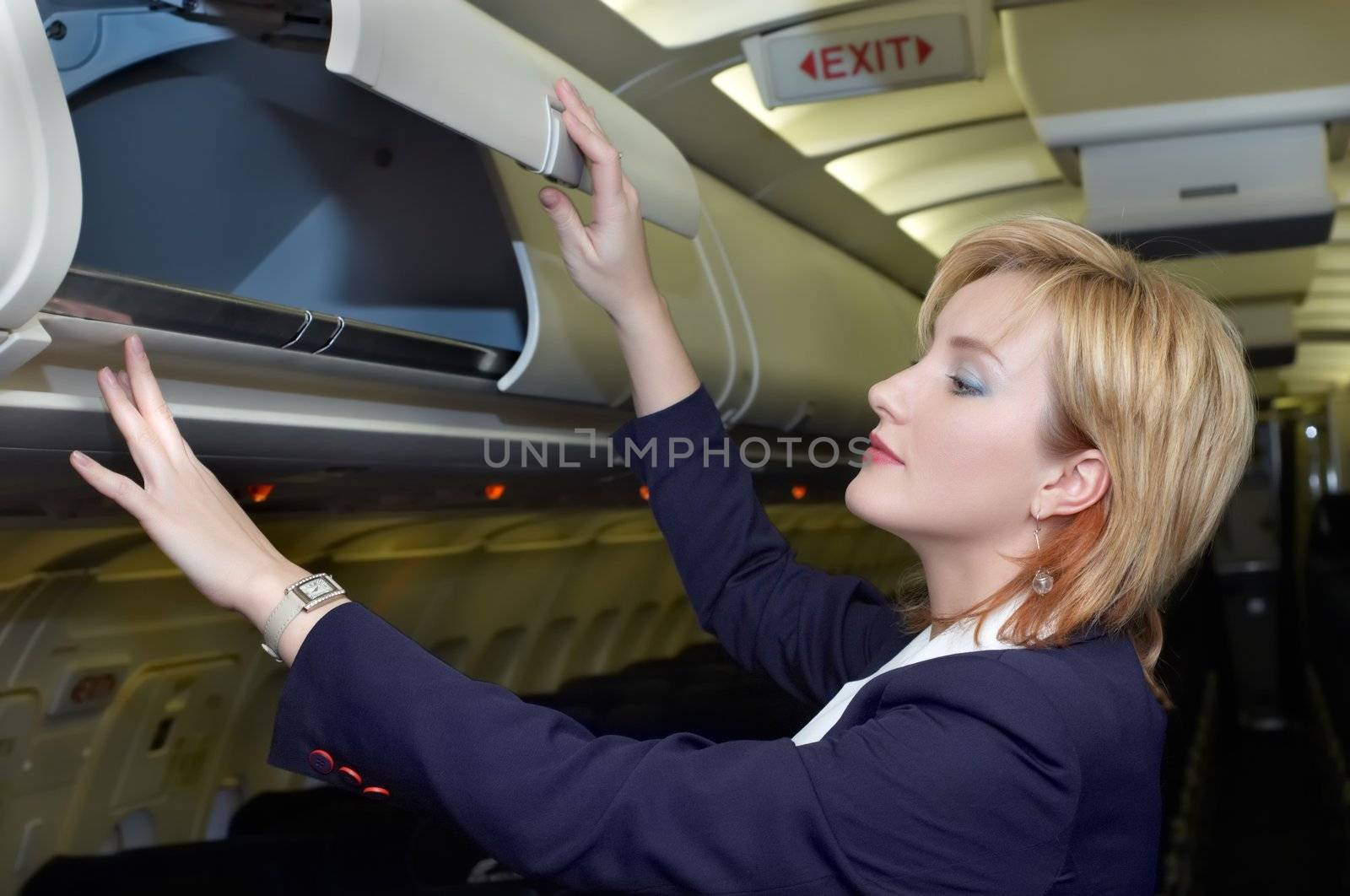 stewardess checking luggage box by starush
