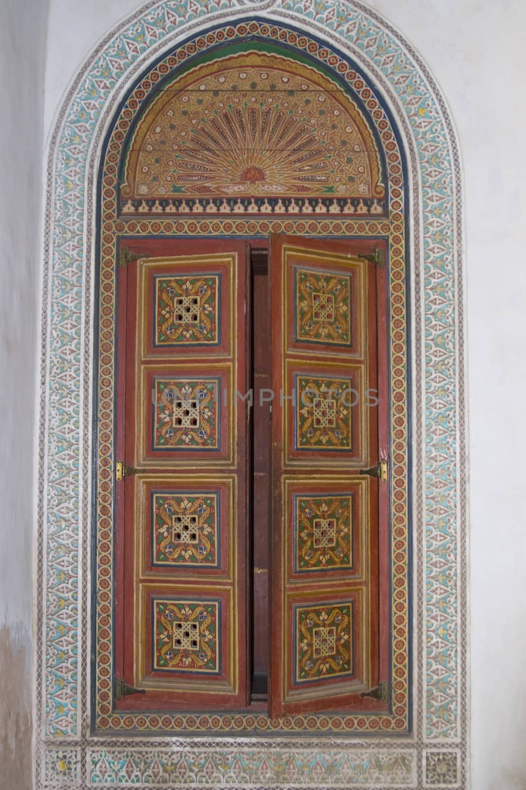 Ornate painted door in the 19th century El Bahia Palace in Marrakesh, Morocco.