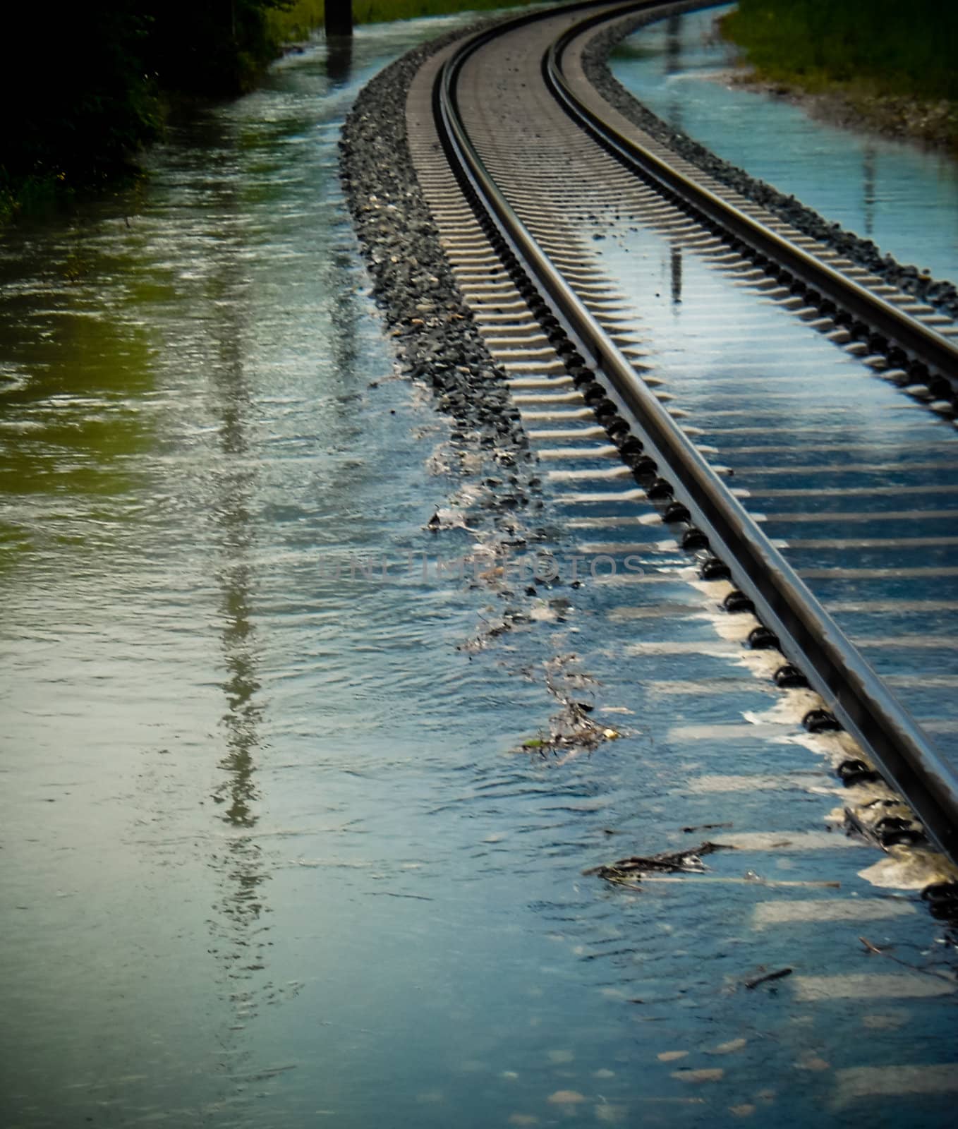 A rail track leads into high water