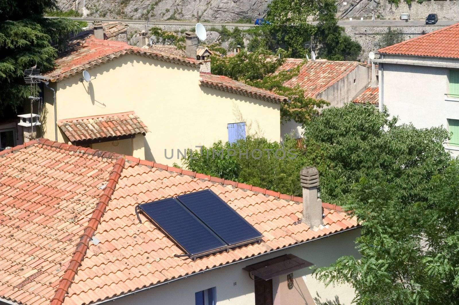Heat solar water installed on a roof of Anduze, French city in the south-east of France.