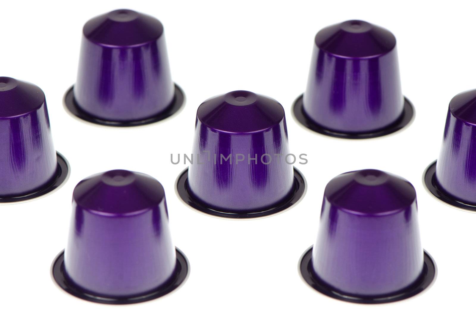 Coffee capsules for a coffee machine isolated on white background.