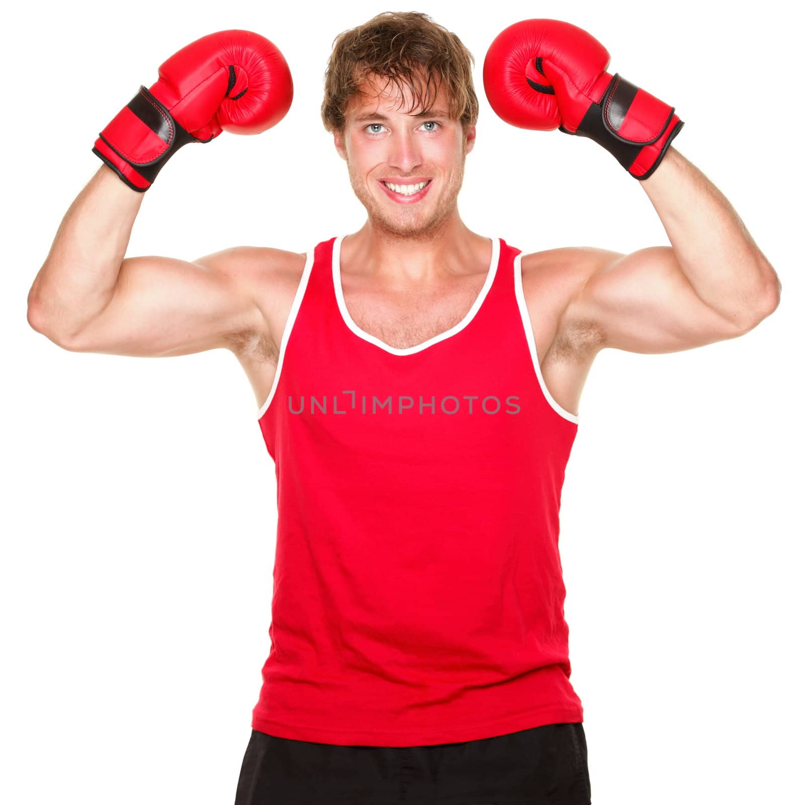 Fitness boxing man showing strength flexing muscles. Handsome strong fit boxer smiling happy wearing red boxing gloves isolated on white background.