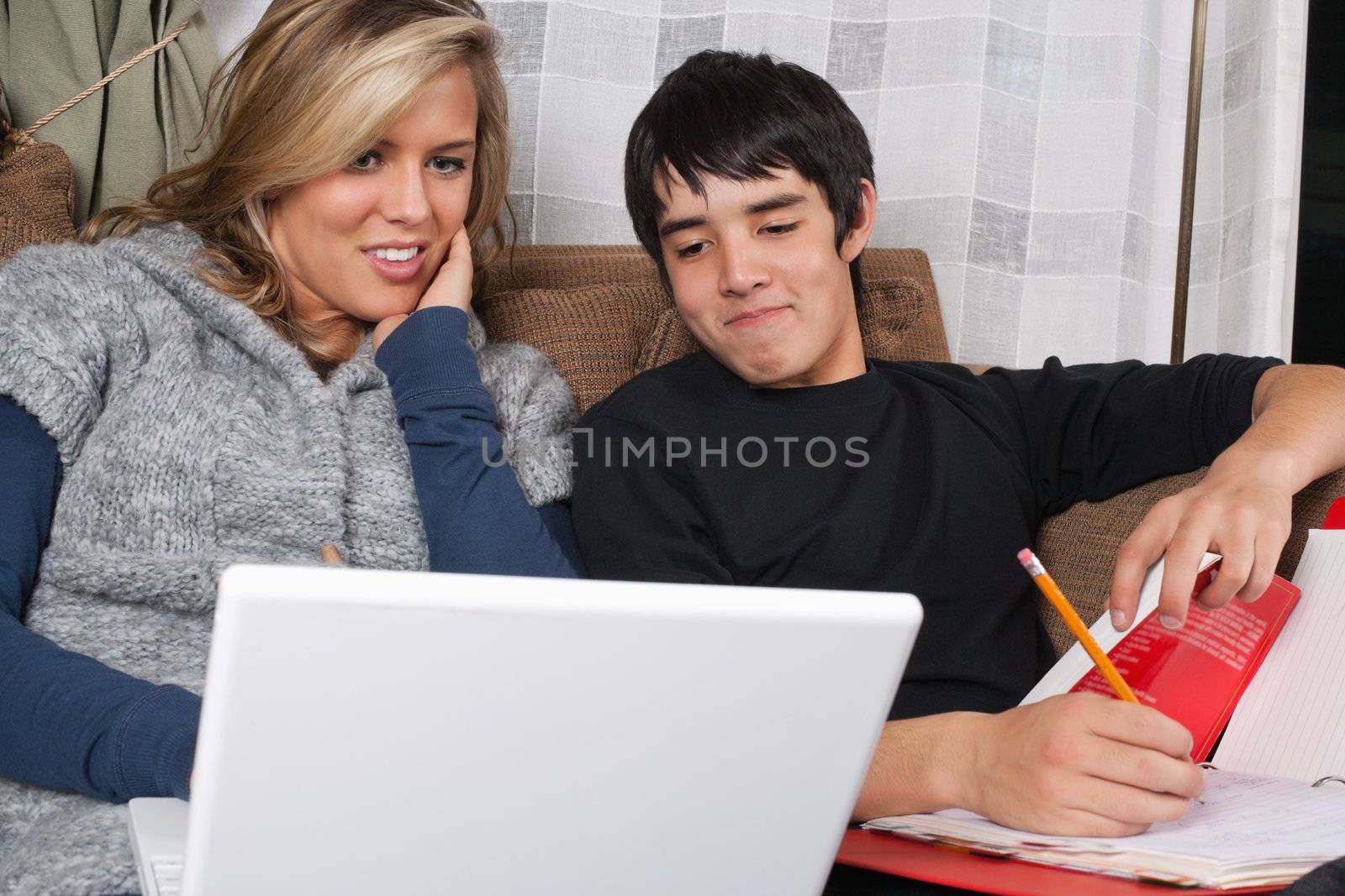 Photo of two students doing homework together.