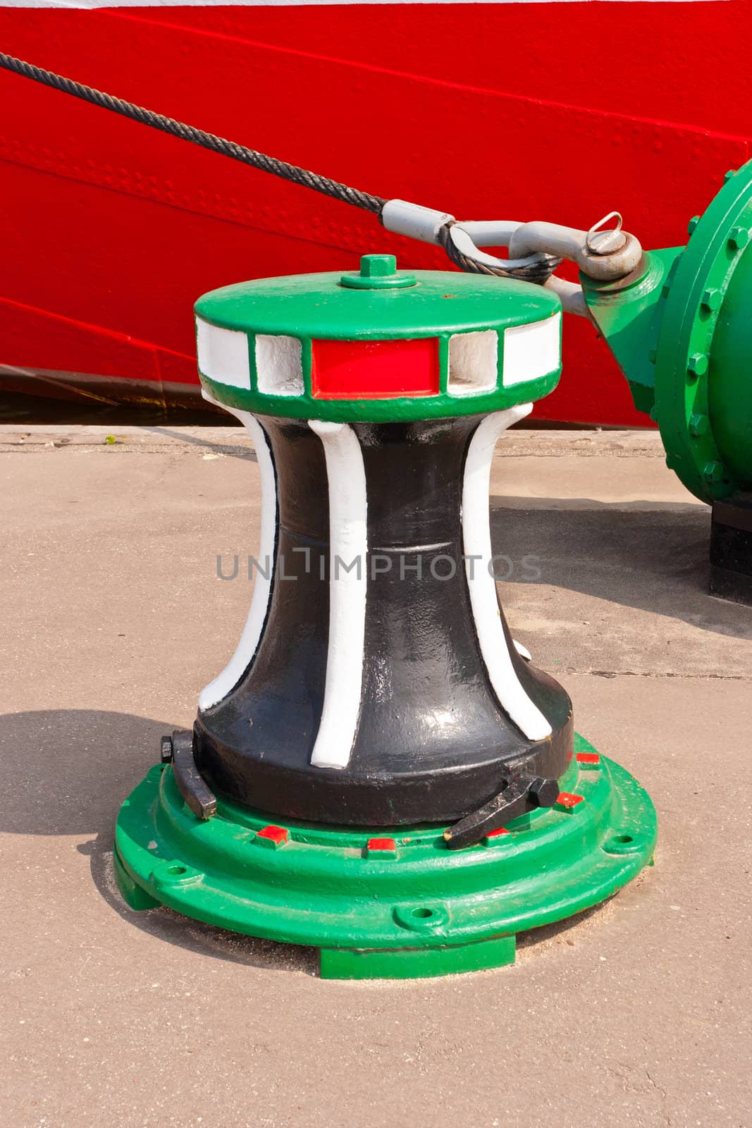 Bollard is a short vertical post used on a quay for mooring.