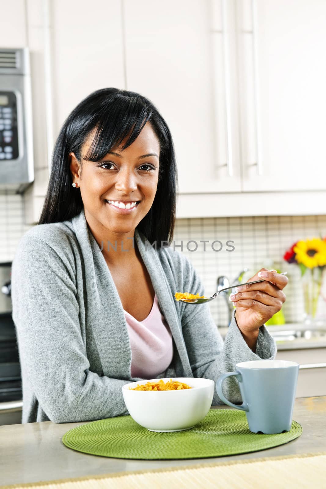 Woman having breakfast by elenathewise