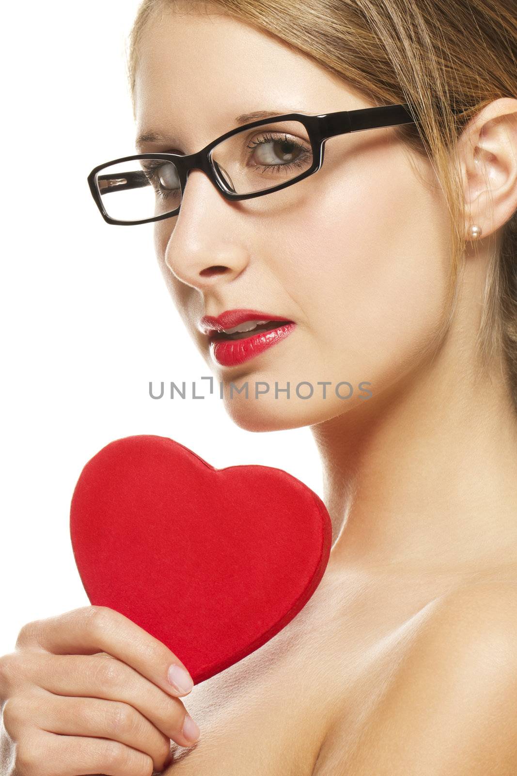beautiful woman with glasses holding red heart on white background