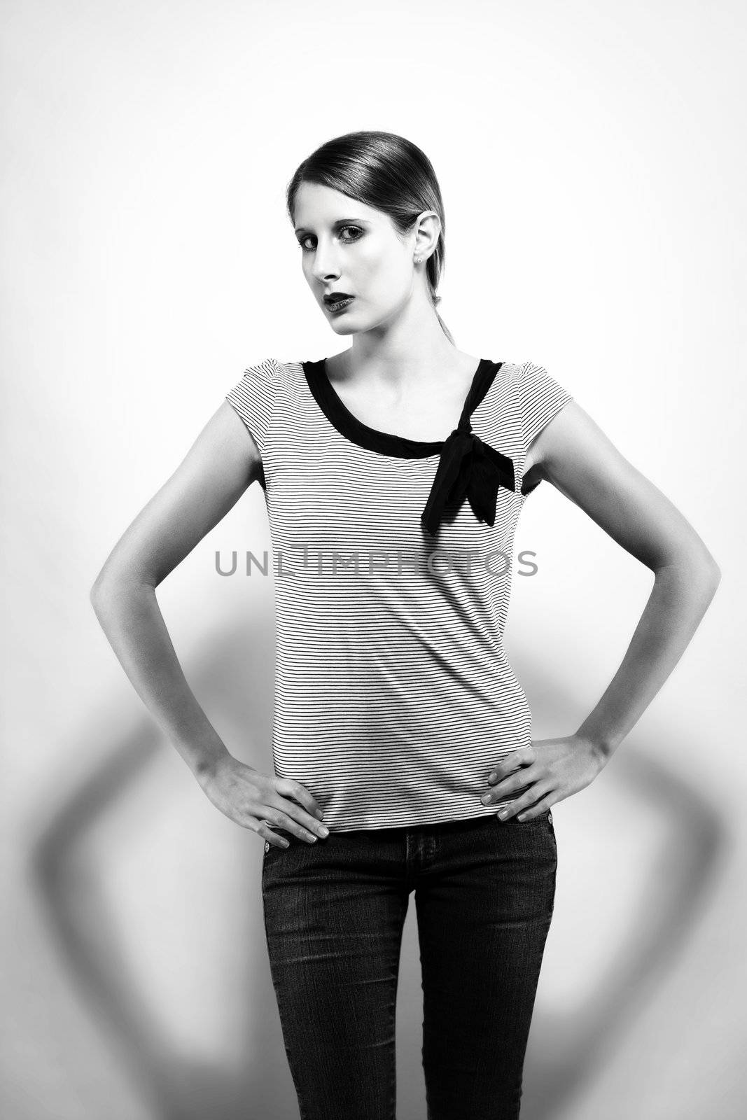 beautiful woman with jeans in black and white hight contrast on white background