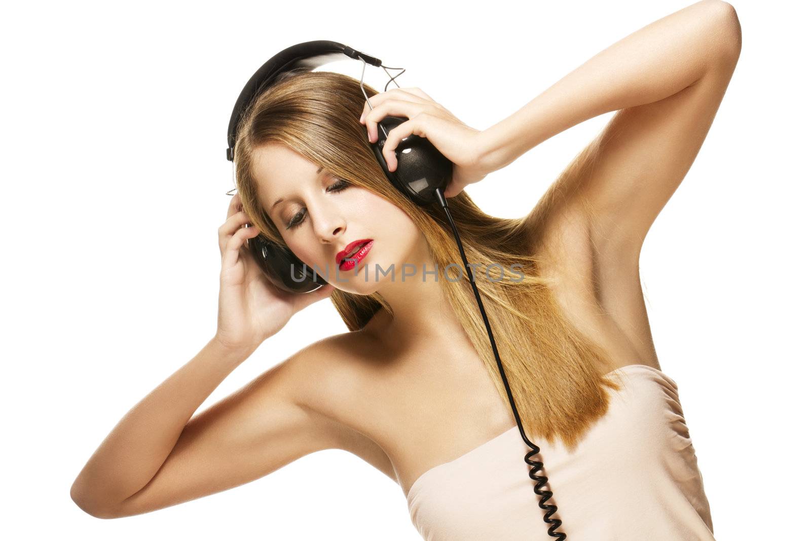 beautiful woman with headphones listening to music on white background