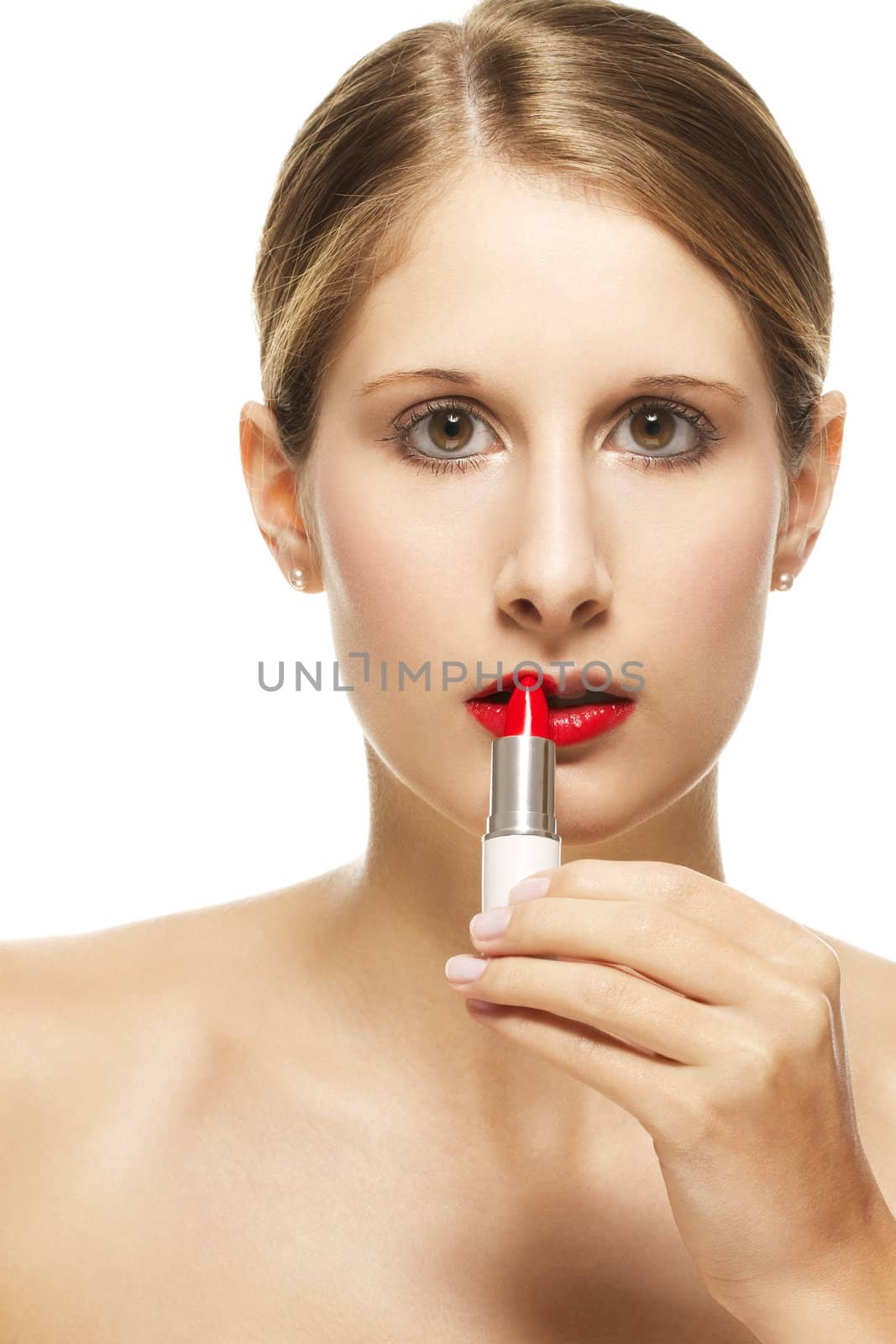 beautiful woman put on lipstick on white background