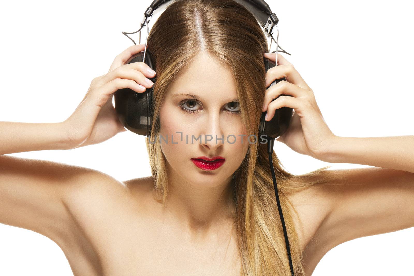 beautiful woman with headphones spreading her arms on white background