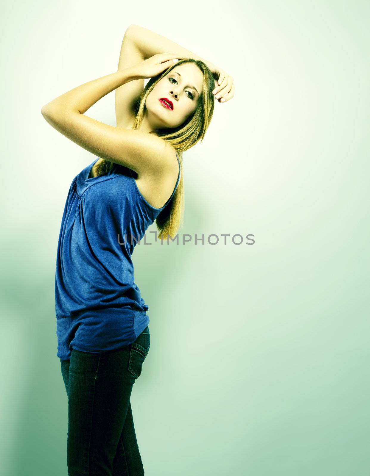 blonde woman posing in green light