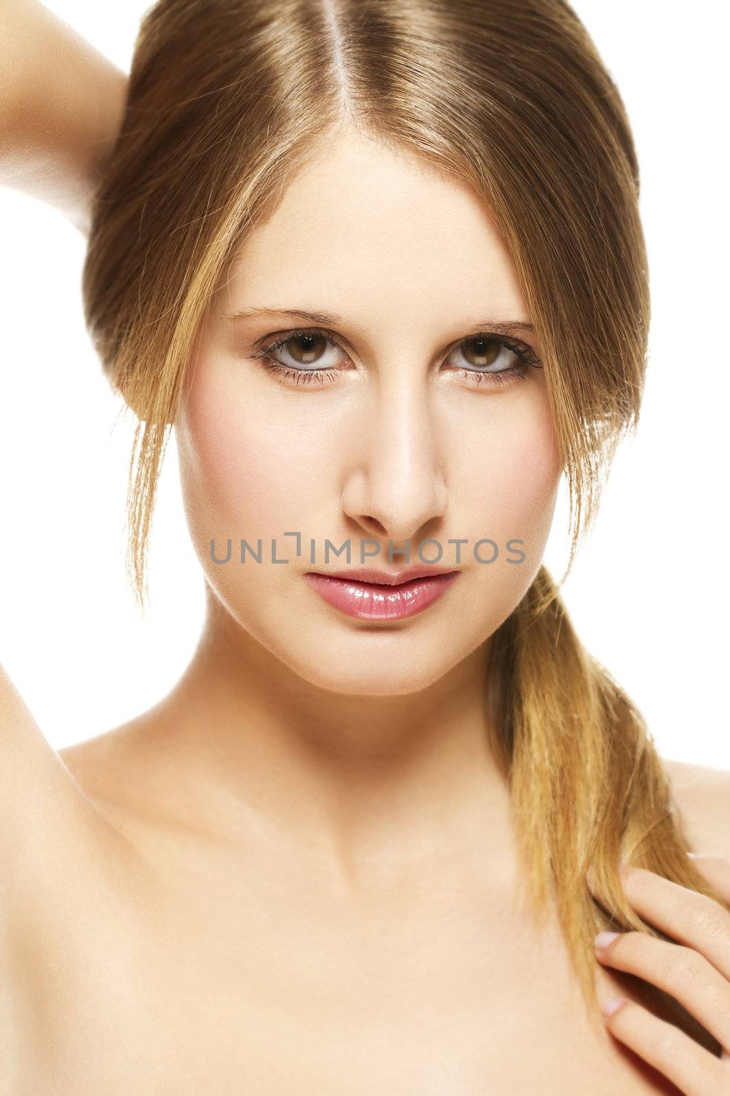 young beautiful woman holding her pigtail on white background