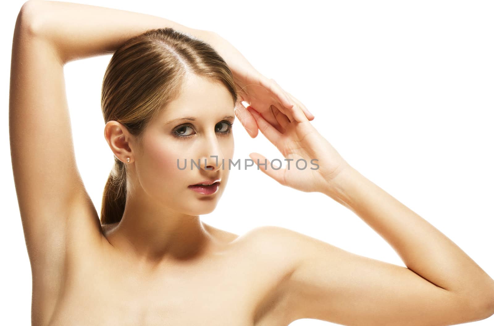 beautiful young blonde woman holding arms over her head on white background