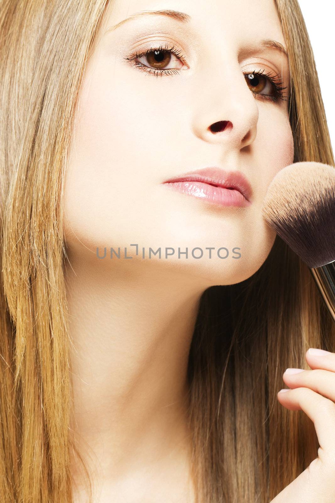 beautiful young blonde woman put on makeup