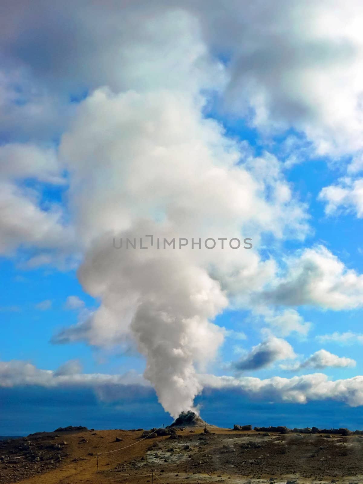 Big solfatara with steam and vapor into the sky in Iceland