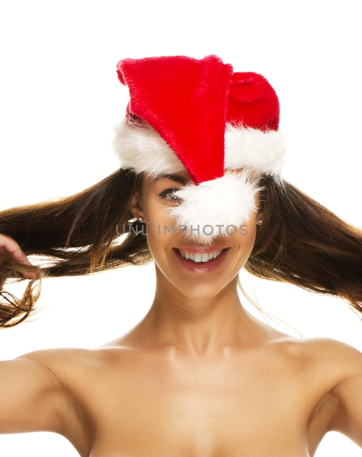 young brunette woman having fun with santas hat on white background