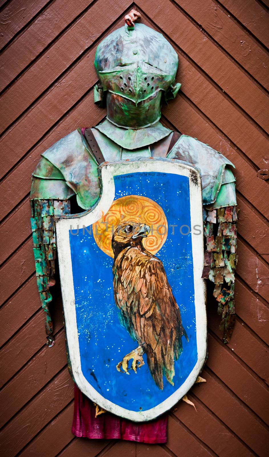 Knights armour hanging on the wooden door by dmitryelagin