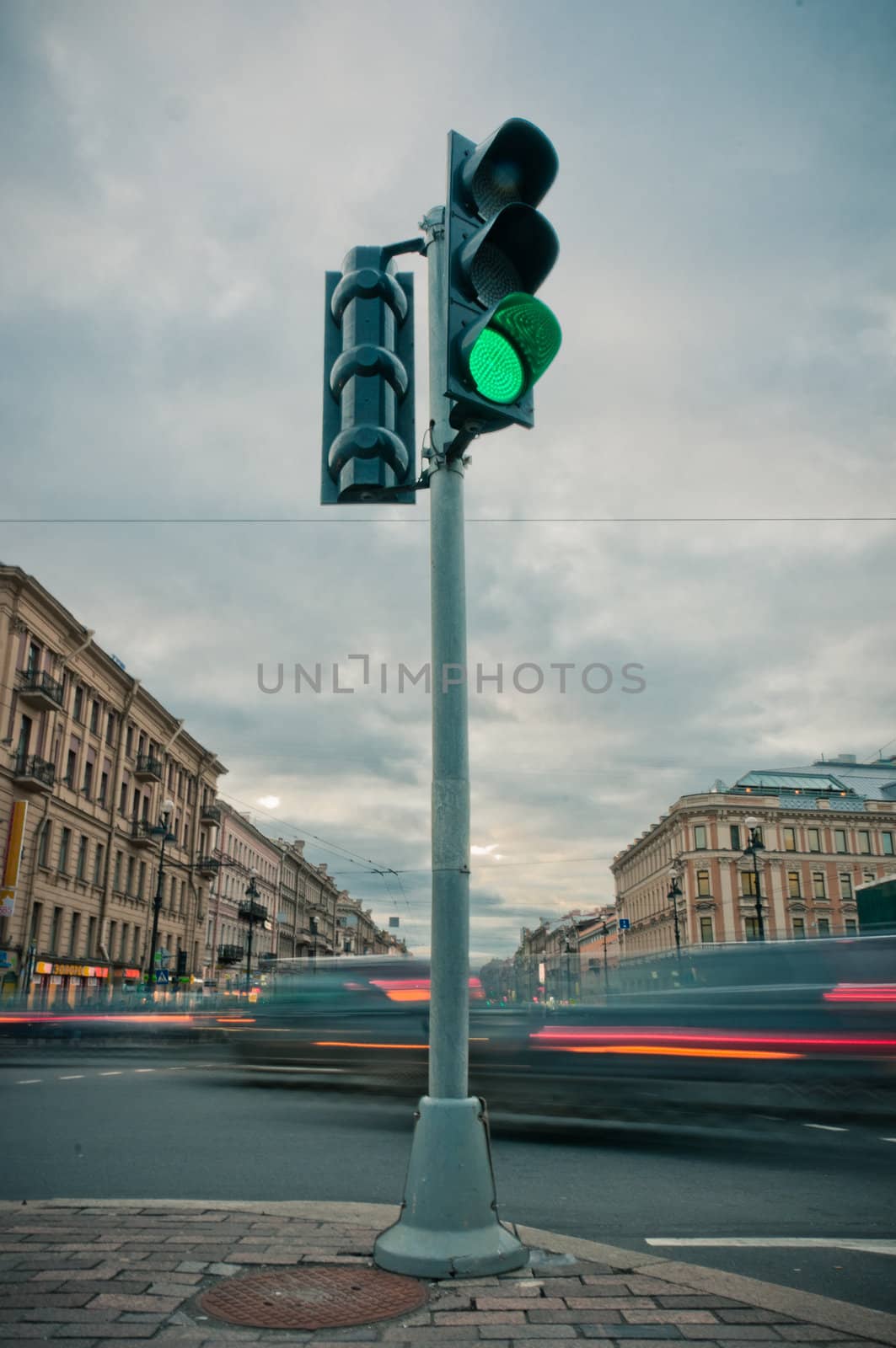 Traffic lights in street center by dmitryelagin