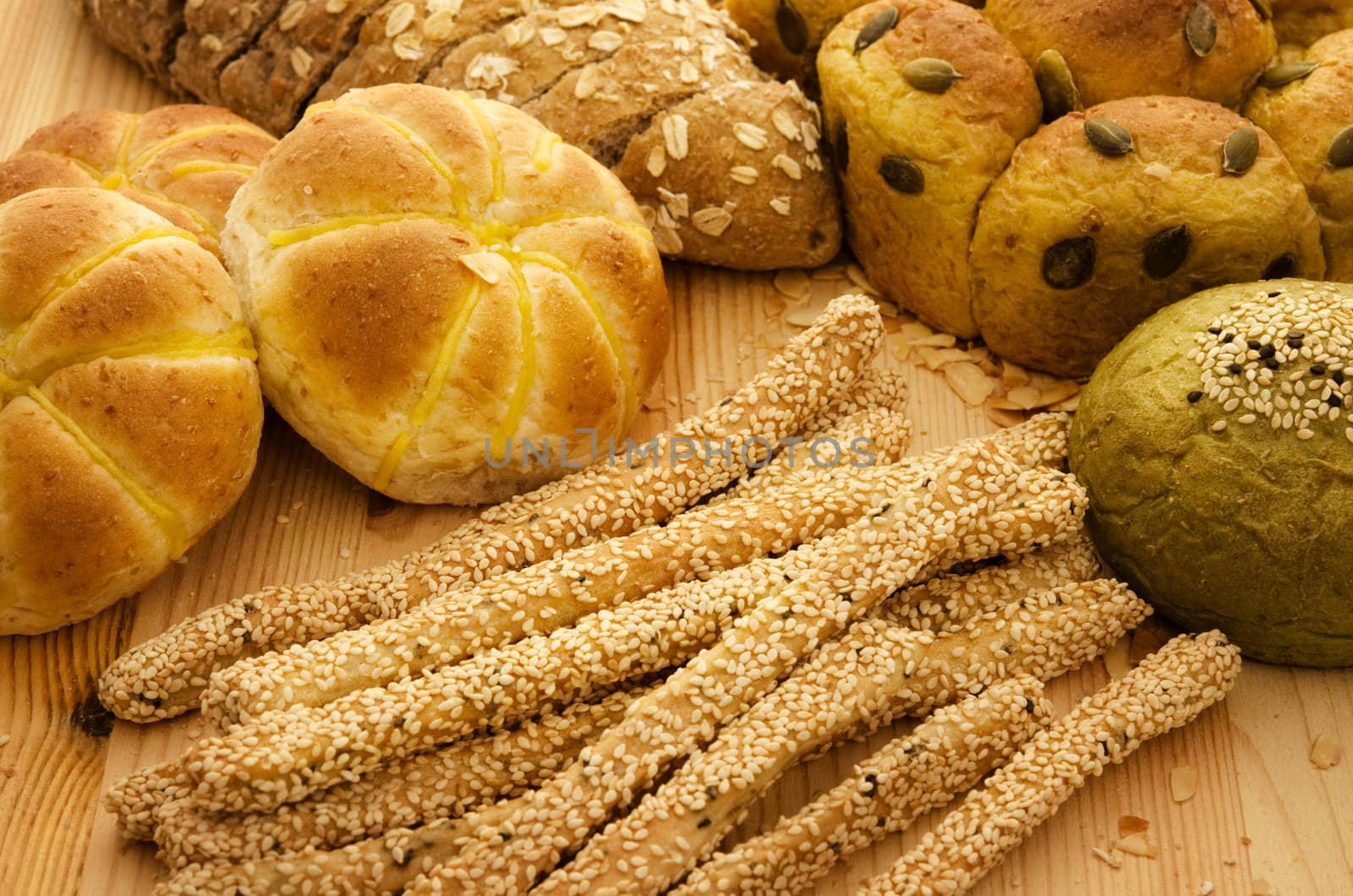 Variety of Organic Breads on plank background