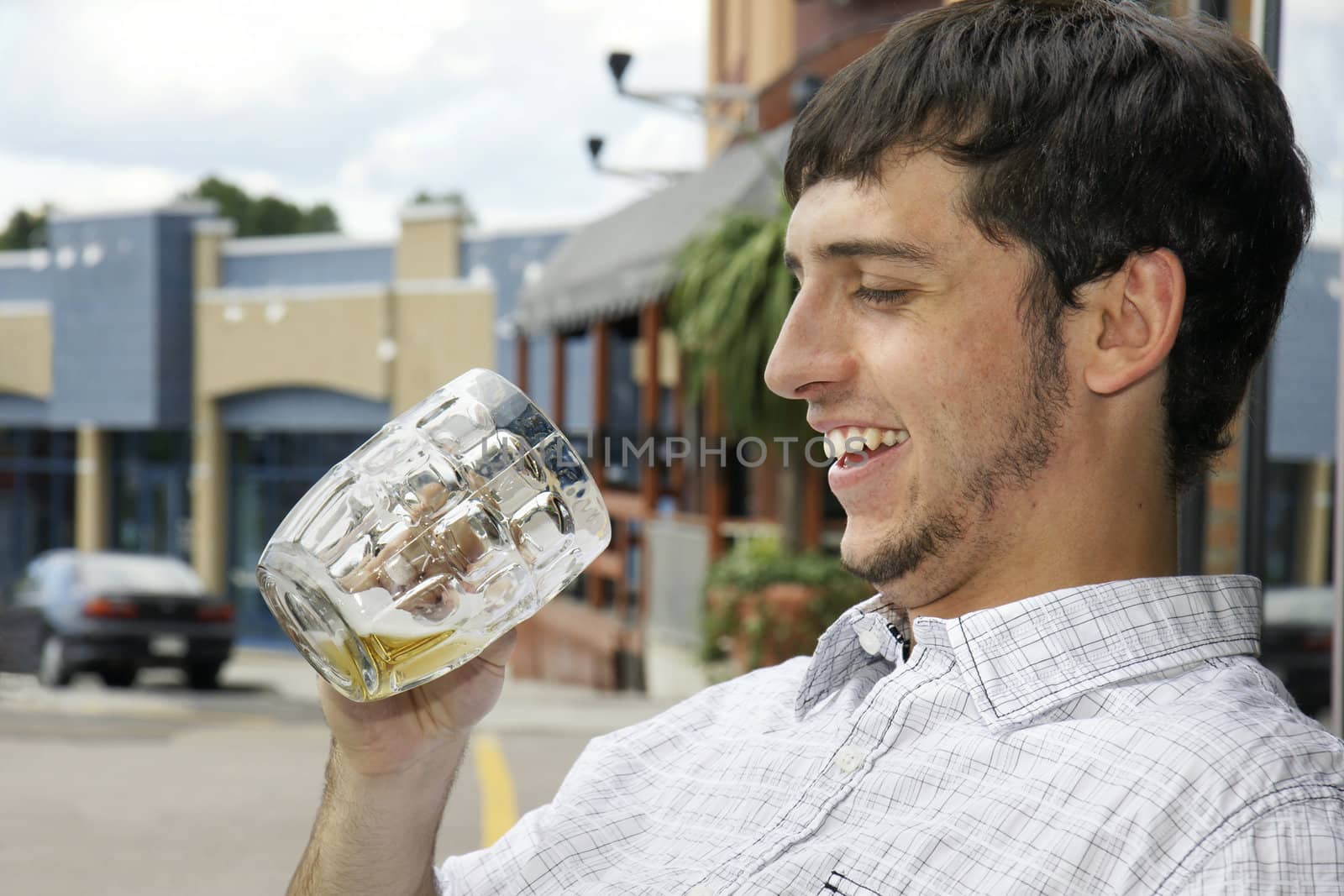 Happy drinking young guy by Mirage3