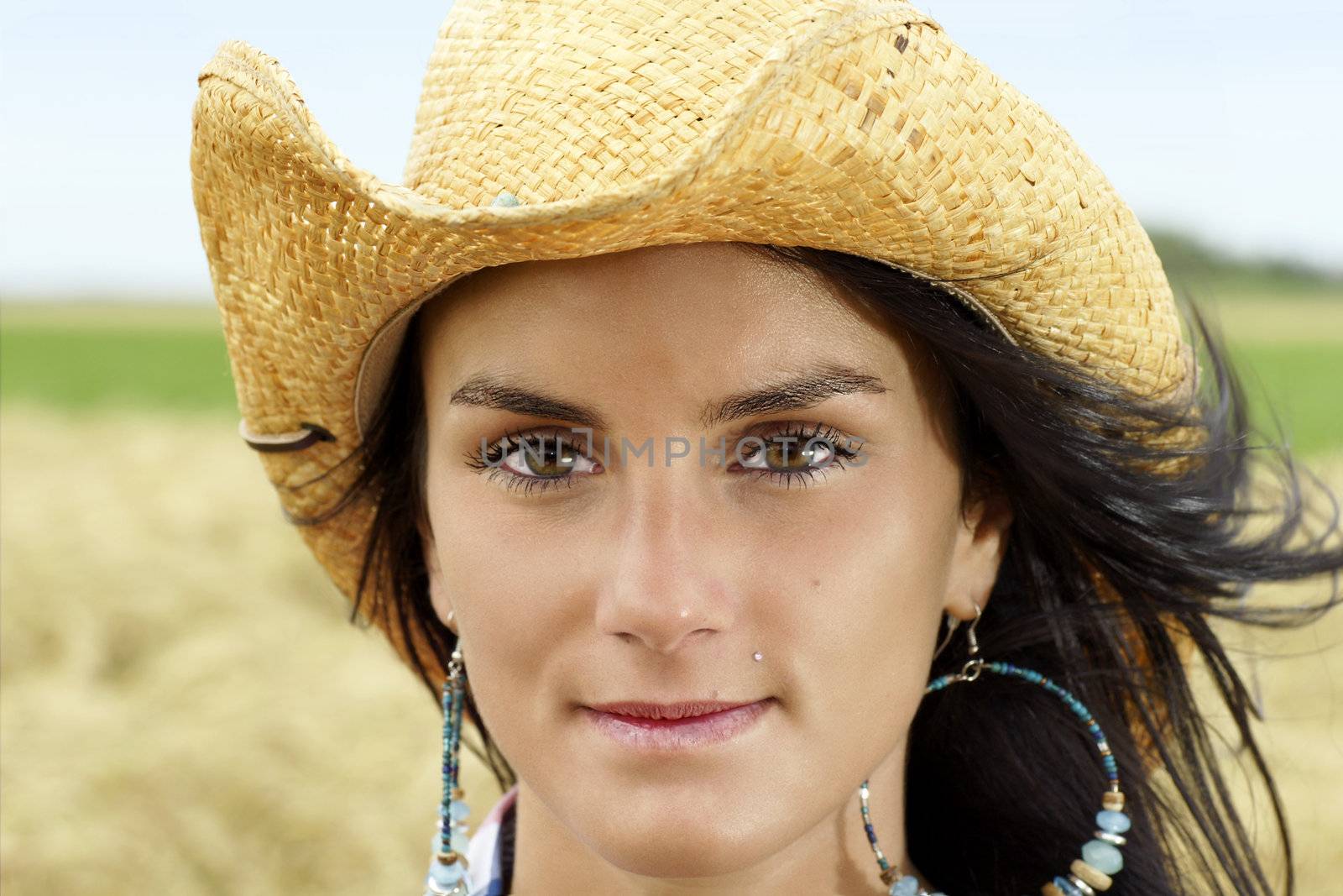 Portrait of cowgirl with hint of a smile by Mirage3