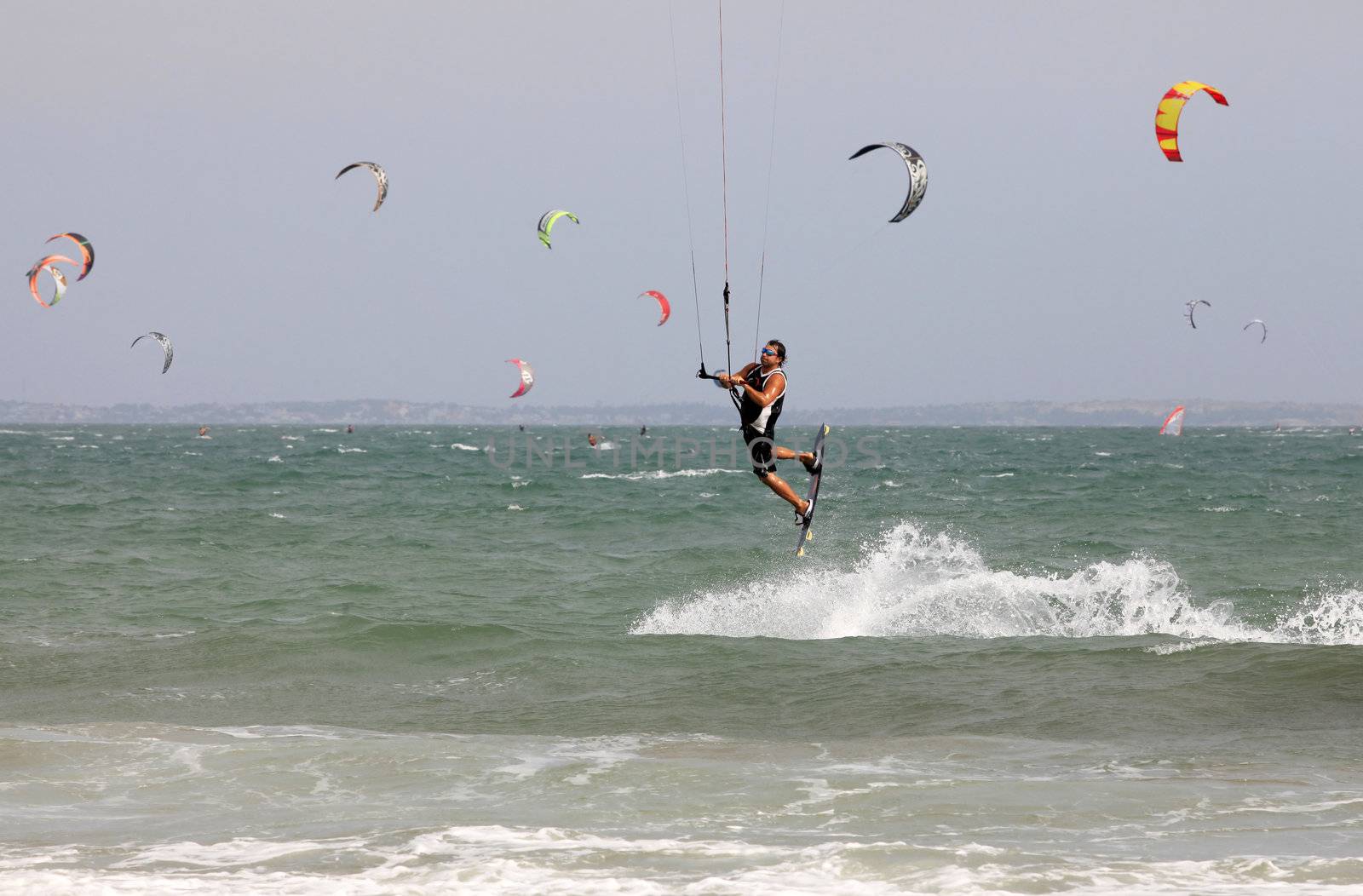 Kiteboarder enjoy surfing in ocean. Vietnam